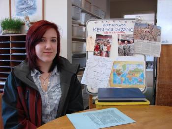 Helena Solorzano with a copy of the letter her soldier father wrote to thank his daughter's school for donations to children in Afghanistan. In the background is information the school gathered about Ken Solorzano and the country where he is currently serving. SUSAN JOHNS/Wiscasset Newspaper