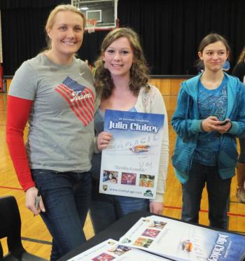 Julia Clukey takes time to sign posters and pose for a photo with Kasey Cromwell after her motivational speech to Wiscasset High School students on April 5. KATHY ONORATO/Wiscasset Newspaper