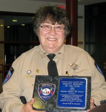 2012 Lincoln County Deputy of the Year, Deputy Eleanor Grover, proudly displays her award. Below: Eileen Harvey displays the special award she received from the Sheriff's Office. Courtesy of the Lincoln County Sheriff's Office 2012 Lincoln County Deputy of the Year, Deputy Eleanor Grover, proudly displays her award. Courtesy of the Lincoln County Sheriff's Office.