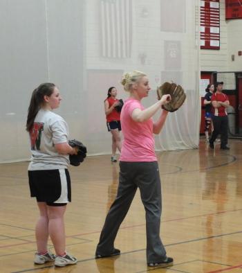 Coach Claire Daniels, right, gives some throwing tips to Charlene Reed at a recent practice at Wiscasset High School. KATHY ONORATO/Wiscasset Newspaper