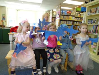 Story Time children display their own Pete and his shoes. The cats held still for a picture except for Henry’s who jumped in front of his face as the picture was being taken. Courtesy of Wiscasset Public Library