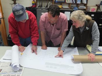 Woolwich Selectmen look over preliminary sketches of a proposed town office addition to be approved by voters at the annual town meeting May 8. From left are Lloyd Coombs, Jason Shaw and Allison Hepler. JOHN MAGUIRE/Wiscasset Newspaper