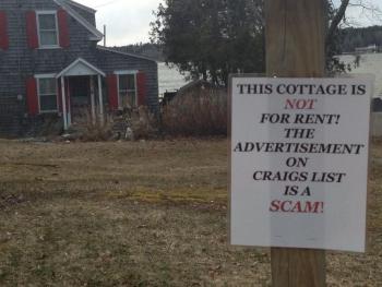 Concerned neighbors put this sign up in front of this Roads End property last week to warn people the rental listing for it on Craigslist is a scam. LISA KRISTOFF/Boothbay Register