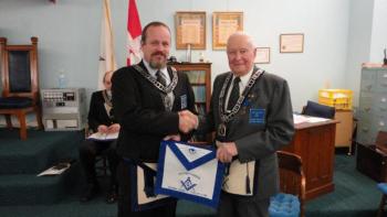 Curtis W. West, right, receives his Life Member apron from Worshipful Mike Leighton. Courtesy of Gary Tilton Curtis W. West, right, receives his Life Member apron from Worshipful Mike Leighton. Courtesy of Gary Tilton