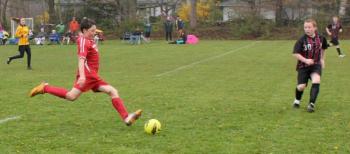 Simon Spear shows perfect kicking form at midfield. SUE MELLO/Boothbay Register Simon Spear shows perfect kicking form at midfield. SUE MELLO/Boothbay Register