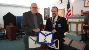 Merlin H. Gray, left, is presented his Life Member apron by Worshipful Mike Leighton. Below: Newest Master Mason Zachary Robert Barry and Lifetime Member Curtis W. West. Courtesy of Gary Tilton