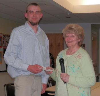 Wiscasset senior Brandon Williams accepts the Wiscasset Senior Center Scholarship from selection committee member, Arlene Polewarczyk. Courtesy of Wiscasset Senior Center