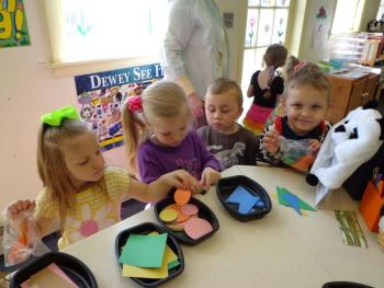 Story Time participants pick out shapes to take home and make pictures. Examples were demonstrated using the shapes. With collective imagination, houses, wagons, cars and more were created. Courtesy of Wiscasset Public Library 