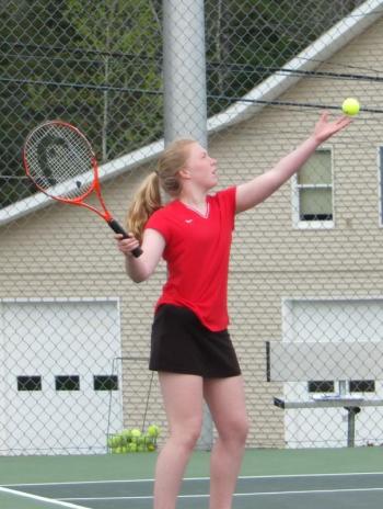 Maeve Carlson is set to serve in her singles match on May 8. KATHY ONORATO/Wiscasset Newspaper