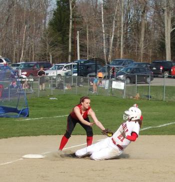 Heidi Pinkham puts a tag on Hall-Dale’s Emily Maynard on Monday, April 29. KATHY ONORATO/Wiscasset Newspaper
