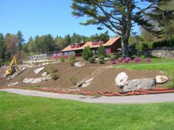 Outside the Boothbay Harbor Country Club clubhouse, landscapers have readied the front apron for plantings. Below: Clubhouse manager Ally Melchreit and assistant pro Raynor Lynn. JOE GELARDEN/Boothbay Register Outside the Boothbay Harbor Country Club clubhouse, landscapers have readied the front apron for plantings. JOE GELARDEN/Boothbay Register