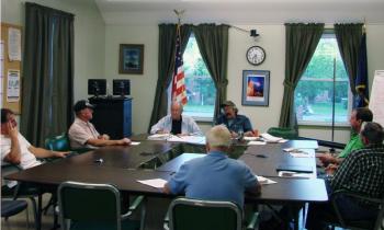 Wiscasset Budget Committee members, clockwise from left, John Merry, Bill Barnes, Norman Guidoboni, Chairman Bob Blagden, Neil Page, Richard Hanson and Ray Soule deliberate June 20. SUSAN JOHNS/Wiscasset Newspaper