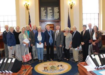 Family and friends of the late Bruce Stedman gather at the State House in Augusta to hear Sen. Chris Johnson present a Legislature Sentiment remembering his public service. Courtesy of Mary Ellen Barnes
