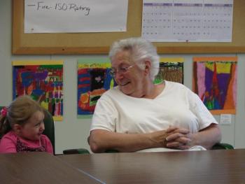 3-year-old Dezirae Colby and her grandmother, Selectman Judy Colby, share a moment at the board table. SUSAN JOHNS/Wiscasset Newspaper