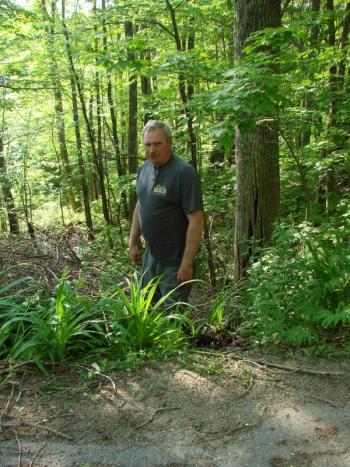 Alna Road Commissioner Jeff Verney stands near where the edge of a ravine is getting closer to North Old Sheepscot Road. SUSAN JOHNS/Wiscasset Newspaper