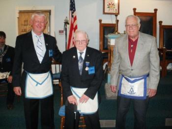 Eugene Kelley, center, is presented his 50 Year Service medal by Arnold Thibodeau, left, and John Arsenault at a recent meeting at Seaside Lodge of Masons. Courtesy of Gary Tilton