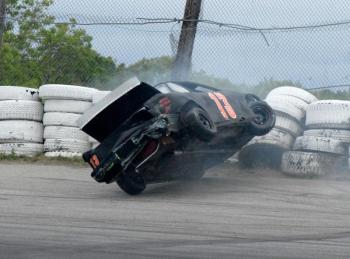 Nate Tribett's #13 car hits the wall in the Mini Outlaw division’s lap 21 on Saturday, June 8 at the Wiscasset Speedway. Courtesy of Peter Taylor, Wiscasset Speedway