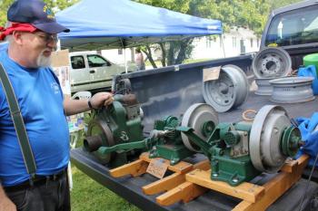 Elwin Plummer of Casco restored these antique washing machine engines. SUE MELLO/Boothbay Register