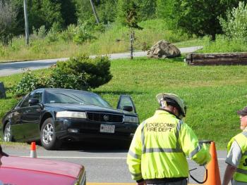 A Cadillac sedan was rear-ended by a Chevrolet Silverado on Route 1 in Edgecomb on July 5. Edgecomb Fire Chief Roy Potter directs traffic. RYAN LEIGHTON/Boothbay Register
