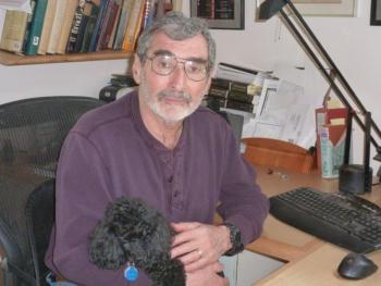 Biographer Fred Kaplan sits at his home office in Boothbay with his black toy poodle Kai as his constant companion. KATRINA CLARK/Boothbay Register