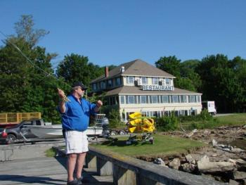 Forrest Faulkingham demonstrates a fishing technique at the Recreational Pier in Wiscasset. SUSAN JOHNS/Wiscasset Newspaper