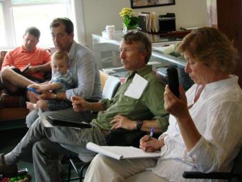 Four committee members and a baby: From left, Wiscasset Parks & Recreation Department Director Todd Souza, “Wings Over Wiscasset” producer Dennis St. Pierre with son Oliver Gadebirk-St. Pierre, age 1, Boothbay Railway Village Board of Directors President Stephen Williams and Wiscasset Municipal Airport employee Kim Powers meet with fellow “WOW” committee members at the airport July 8. SUSAN JOHNS/Wiscasset Newspaper Four committee members and a baby: From left, Wiscasset Parks & Recreation Department Director Todd Souza, “Wings Over Wiscasset” producer Dennis St. Pierre with son Oliver Gadebirk-St. Pierre, age 1, Boothbay Railway Village Board of Directors President Stephen Williams and Wiscasset Municipal Airport employee Kim Powers meet with fellow “WOW” committee members at the airport July 8. SUSAN JOHNS/Wiscasset Newspaper