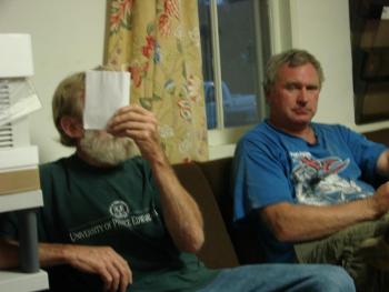 Behind this paper is Sheepscot Valley Regional School Unit board member Ralph Hilton of Alna, speaking at the August 22 Alna selectmen's meeting.  At right is Alna Road Commissioner Jeff Verney. SUSAN JOHNS/Wiscasset Newspaper