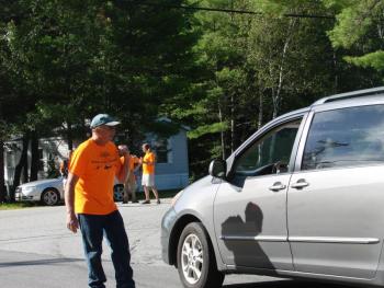“Wings” volunteer Bryan Buck helps direct traffic near the Wiscasset Municipal Airport the morning of the event. Volunteers played a vital role in “Wings,” and next year, organizers hope to secure them sooner. SUSAN JOHNS/Wiscasset Newspaper