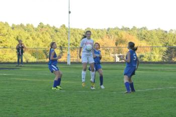 Brooke Carleton, center, jumps to corral the ball in front of a slew of Boothbay defenders. Carleton had one of Wiscasset’s nine goals Saturday, Sept. 28. BEN BULKELEY/Wiscasset Newspaper