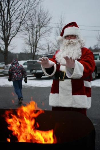 Santa warms his gloved hands at a 2012 holiday event. Courtesy of Wiscasset Area Chamber of Commerce Santa warms his gloved hands at a 2012 holiday event. Courtesy of Wiscasset Area Chamber of Commerce