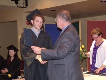 School Superintendent Steven Bailey presents Samuel Margaritis with his High School Equivalency Diploma. (Adult Education Director Ellen Dickens pictured in background). Courtesy of Bonnie Merrill