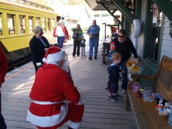 Santa is making plans for his summer vacation in the Boothbay region to support the second annual Toys for Tots toy drive at the Boothbay Railway Village on Friday, July 25. Each adult or child who brings a new, unwrapped toy to donate will be treated to free admission to the museum and, of course, a steam train ride. Courtesy of Margaret Hoffman