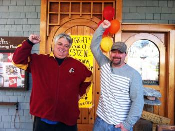 Ralph Smith, left, and Steve Richards stand in front of The World is Mine Oyster the morning after Richards won the Maine Lobster Chef of the Year award at Portland’s Harvest on the Harbor festival on Friday, Oct. 24. SUZI THAYER/Boothbay Register