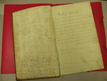 Westport Island's original record book, 1828. The notation inside reads: "Book of Records. For the town of Westport in the County of Lincoln State of Maine and formerly that part of Edgecomb known by the name of Jeremy Squam Island and incorporated by an act of the Legislature of said State of Maine on the fifth day of February in the year of our Lord one thousand eight hundred and twenty eight and organized and went into operation on the seventeenth day of March in the year aforesaid." Simon Dunton, Town Clerk. Courtesy of Gaye Wagner/Westport Island