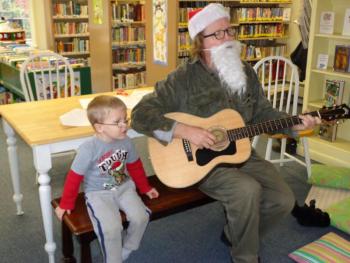 Mat O’Donnell and Xzavier Ordung enjoy the Christmas Carol sing-along at the Wiscasset Public Library Children’s room. Courtesy of Natalie Castonia