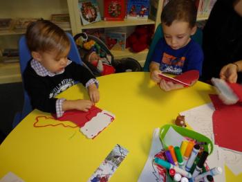 Gabriel Bonilla and Mason Michaud are busy sewing their library stocking. Courtesy of Natalie Castonia