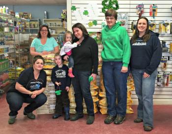 The huge stack of food donated to Underhound Railroad and LCAS. Back row, from left: Director Renee Coombs of Underhound, Annie Martin, Owner of the Animal House Aubrey Martin, Manager of LCAS Betsy Pratt, Officer Manager of LCAS of Carrie Koskela, bottom row: Vanessa Reed-Chapman, jack-of-all-trades for Underhound, and Ryan Martin. KATRINA CLARK/Boothbay Register