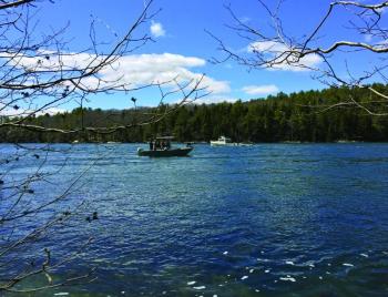A Maine Marine Patrol/Maine State Police boat heads upriver while a Maine State Dive Team boat heads downriver in the search for missing Edgecomb woman, Lynne Crink, on Sunday, April 19. SUZI THAYER/Boothbay Register