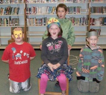 The cast of "The Lion and the Mouse." Pictured from left are Damon, Jenna and Matthias. Sully is standing in the back. Courtesy of Lisa Hardman