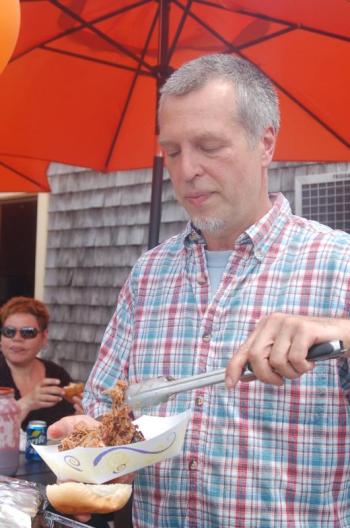 Sumner Richards serves pulled pork at Fernald’s Country Store on Saturday, June 27. ART MAYERS/Wiscasset Newspaper