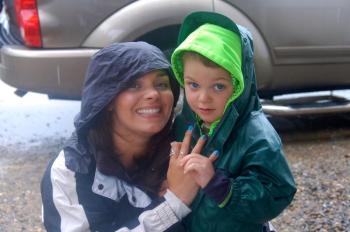 Celeste and Gavin Lincoln of Richmond battle wind and rain to attend Touch-a-Truck event at the Wiscasset Speedway on Sunday, June 28. ART MAYERS/Wiscasset Newspaper