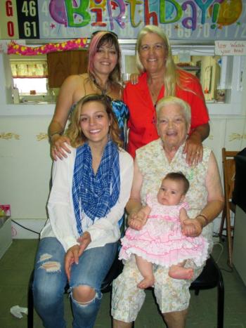 Five generations and counting! Martha Langer Sutter Hyler holds her great-great-granddaughter Jenyvieve Wyman on her lap Saturday afternoon. Also pictured are: rear left to right: Stacey Doray and Sally Doray-Wentworth. In the front is Jyllian York. Relatives and friends gathered at the Huntoon Hill Grange in Wiscasset to celebrate Martha’s 90th birthday. PHIL DI VECE/Wiscasset Newspaper