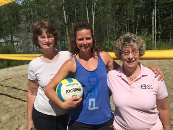 From left, Mary Nickerson, Julie Jones and Sharon Snell take a moment on Jones’ Olympic-sized volleyball court Aug. 28. The three and other family members are among the volunteers for the Dean Snell Foundation named for Snell’s late husband. The court on Suki Lane in Wiscasset is the venue for a fundraiser tournament for the foundation on Sept. 19. SUSAN JOHNS/Wiscasset Newspaper Mary Nickerson, Julie Jones, Sharon Snell, volleyball, Suki Lane, Wiscasset, Dean Snell Foundation, cancer