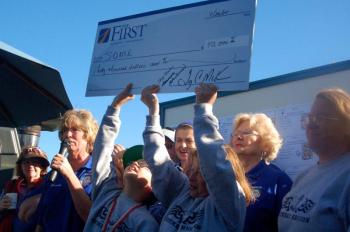 Special Olympians hold high a check for $40,000. ART MAYERS/Boothbay Register