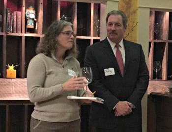 Ellen McFarland, president of the Lincoln County Animal Shelter board, left, with Tony McDonald, president of the Coastal Humane Society board. They drank a toast to the new partnership at the end of McFarland’s speech. KATRINA CLARK/Boothbay Register