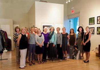 Getting ready for the sale/fundraiser for New Hope For Women (NHFW) last month, from left, are: Margaret Roche, Nancy Braun, Sondra Hartley, Pam Kenniston, Liz May, NHFW Board Member Lauren Kenniston, Marilyn Scott, Susan Schor of Eileen Fisher, Barbara Matton, Otty Merrill, Lisa Breheny, Meg Klingelhofer of NHFW and Kristi Braun of NHFW. Courtesy of www.blissfoto.net
