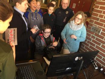 WMHS seventh grader Chris Carr uses a driving simulator Jan. 21 as other students and School Resource Officer Tom Hoepner look on. SUSAN JOHNS/Wiscasset Newspaper