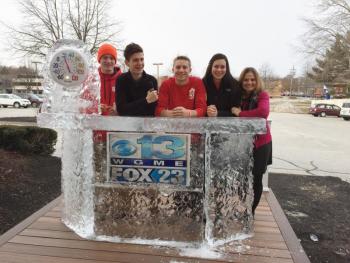 From left, WMHS students Daren Wood, Brandon Goud, Grant Hefler and Kennedy Orr and WMHS technology coordinator and student council adviser Deb Pooler pose at WGME’s frozen weather desk during their trip to the Spirit Challenge finale March 4. Courtesy of Deb Pooler
