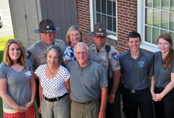 Sometimes it takes a team to save a life. Members of Chris Frost’s team include, from left, front row: LincolnHealth Registered Nurse Amy Tucker, Anne Frost and Chris Frost; back row: Lincoln County Sheriff’s Office Sgt. Alan Shea, Maine Medical Center Registered Nurse Jennifer Carlson, Lincoln County Sheriff’s Office Deputy Brian Collamore, Central Lincoln County Ambulance Service EMT-A Devan Clark and Central Lincoln County Ambulance Service EMT-A Emily Wells. Courtesy of LincolnHealth