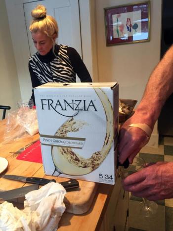 A big box of wine helped move the process of making clams casino along, in Vermont. Adele Bielli in the background. Courtesy of Andy Bielli